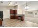 Open kitchen with wood cabinets, stainless appliances, and a view to the adjacent living area at 3634 Cape Ln, Conyers, GA 30013