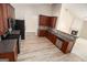 Open-concept kitchen with updated appliances, wood cabinets, and easy access to the fireplace in the living area at 3634 Cape Ln, Conyers, GA 30013