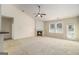 Bright living room features a fireplace, neutral carpet, and access to a patio and back yard at 3634 Cape Ln, Conyers, GA 30013