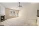 Bright living room features a fireplace, neutral carpet, and access to a patio and back yard at 3634 Cape Ln, Conyers, GA 30013