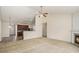 Open concept living room boasts high ceilings, fireplace, and seamless connection to the kitchen at 3634 Cape Ln, Conyers, GA 30013