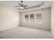 Spacious main bedroom with tray ceilings and ample natural light from large windows at 3634 Cape Ln, Conyers, GA 30013