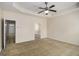 Spacious main bedroom with tray ceilings and adjacent entry to the ensuite bath at 3634 Cape Ln, Conyers, GA 30013