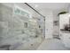 Modern bathroom with a glass-enclosed shower featuring decorative tile work and ample vanity space at 3911 Peeksville Rd, Locust Grove, GA 30248