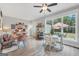 Bright dining area with wooden table and seating, plus view to patio at 3911 Peeksville Rd, Locust Grove, GA 30248