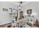 Dining room featuring a white table and chairs, wooden accents, and natural light at 3911 Peeksville Rd, Locust Grove, GA 30248