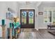 Foyer with double front doors, decorative accents, and a view to the outdoors at 3911 Peeksville Rd, Locust Grove, GA 30248