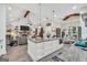Open kitchen featuring granite countertops, island with storage, and stainless steel appliances at 3911 Peeksville Rd, Locust Grove, GA 30248