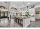 Spacious kitchen features a large granite island with seating, modern appliances, and open layout at 3911 Peeksville Rd, Locust Grove, GA 30248