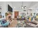 Living room featuring gray couches, a brick fireplace, and wood sliding barn doors at 3911 Peeksville Rd, Locust Grove, GA 30248