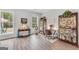 Inviting living room featuring natural light, hardwood floors, and charming decor at 3911 Peeksville Rd, Locust Grove, GA 30248