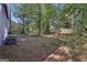 Lush backyard features a combination of lawn space and mature trees at 5362 Kelleys Mill Cir, Stone Mountain, GA 30088