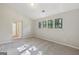 Bedroom featuring three windows, carpeted floor, and neutral paint at 5362 Kelleys Mill Cir, Stone Mountain, GA 30088