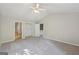 Bedroom features a carpeted floor, neutral paint, and walk in closet at 5362 Kelleys Mill Cir, Stone Mountain, GA 30088