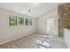 Bedroom boasts lots of natural light and a stone feature wall at 5362 Kelleys Mill Cir, Stone Mountain, GA 30088