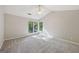Bright bedroom featuring a ceiling fan and many windows at 5362 Kelleys Mill Cir, Stone Mountain, GA 30088