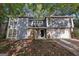 Charming two-story home with a stone accent, attached garage and professionally landscaped front yard at 5362 Kelleys Mill Cir, Stone Mountain, GA 30088