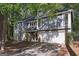Charming two-story home with a stone accent, attached garage and professionally landscaped front yard at 5362 Kelleys Mill Cir, Stone Mountain, GA 30088