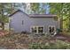 Exterior of home with light gray siding and sliding glass doors at 5362 Kelleys Mill Cir, Stone Mountain, GA 30088