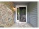 Close up on the front door with stone accents and sidelight at 5362 Kelleys Mill Cir, Stone Mountain, GA 30088