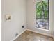 Laundry room features a window, tile floor, and hook ups at 5362 Kelleys Mill Cir, Stone Mountain, GA 30088
