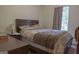 Cozy bedroom featuring a comfortable bed and natural light from the window at 714 Yates Rd, Bowdon, GA 30108