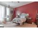 Bedroom featuring a comfortable bed, desk, and large windows providing ample natural light at 714 Yates Rd, Bowdon, GA 30108