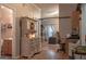 Hallway featuring wooden floors, a built-in hutch, and views into the living area and bathroom at 714 Yates Rd, Bowdon, GA 30108