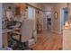 Hallway leads to living area featuring hardwood flooring and neutral paint colors at 714 Yates Rd, Bowdon, GA 30108