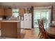 Eat-in kitchen featuring ample cabinets, modern appliances, and sliding doors to the outdoors at 714 Yates Rd, Bowdon, GA 30108