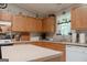 Spacious kitchen featuring wood cabinets, modern appliances, and a kitchen island at 714 Yates Rd, Bowdon, GA 30108