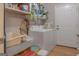 Functional laundry room with washer, dryer, shelves and access to a door at 714 Yates Rd, Bowdon, GA 30108