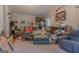 View of the living room with a sloped ceiling and a comfortable seating area and carpet at 714 Yates Rd, Bowdon, GA 30108