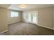 Finished basement with neutral carpet and french doors at 4049 Brookcrest Cir, Decatur, GA 30032