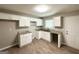 Bright eat-in kitchen with white cabinets, laminate counters, and stainless steel sink at 4049 Brookcrest Cir, Decatur, GA 30032
