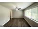 Bright living room with hardwood floors, ceiling fan, and large window at 4049 Brookcrest Cir, Decatur, GA 30032