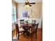 Cozy dining area with wainscoting, hardwood floors, and a charming round table with seating for four at 511 Bonneset Ct, Canton, GA 30114