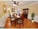 Traditional dining room with hardwood floors, wainscoting, and a classic china cabinet at 511 Bonneset Ct, Canton, GA 30114