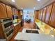 Updated kitchen with granite countertops, stainless steel appliances, and adjacent dining area for seamless entertaining at 511 Bonneset Ct, Canton, GA 30114