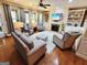 Comfortable living room with a fireplace, built-in shelving, hardwood floors, and ample seating at 511 Bonneset Ct, Canton, GA 30114