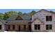 View of new home under construction showing roof, porch and window placement at 95 Cambridge, Covington, GA 30014