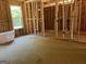 Framing of new home construction with window and plumbing details at 95 Cambridge, Covington, GA 30014