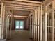 Framing of new home construction showing exterior door and window placement at 95 Cambridge, Covington, GA 30014