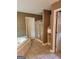 Bathroom showcasing a soaking tub, a shower, and built-in shelving for linens and toiletries at 350 Lakeview Dr, Brooks, GA 30205