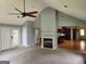 Spacious living room featuring a fireplace and access to kitchen and outdoor area at 350 Lakeview Dr, Brooks, GA 30205