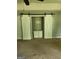 Spacious living room featuring sliding barn doors and built-in shelving at 350 Lakeview Dr, Brooks, GA 30205