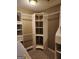 Bright walk-in closet with organizers, custom storage, and shelving for optimal space at 350 Lakeview Dr, Brooks, GA 30205