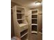Walk-in closet with adjustable shelving and hanging rods for clothing storage at 350 Lakeview Dr, Brooks, GA 30205