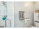 Bathroom shower with glass door, modern fixtures, and towel racks at 4333 Deer Ridge Ct, Lilburn, GA 30047