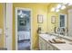 Bright bathroom featuring a sink vanity and a glimpse into an adjoining bedroom at 4333 Deer Ridge Ct, Lilburn, GA 30047